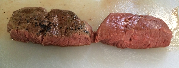 The final product cut in half to show cross-section.  Both steaks are evenly done all the way through, with the seared steak having the familiar brownish color on the surface.